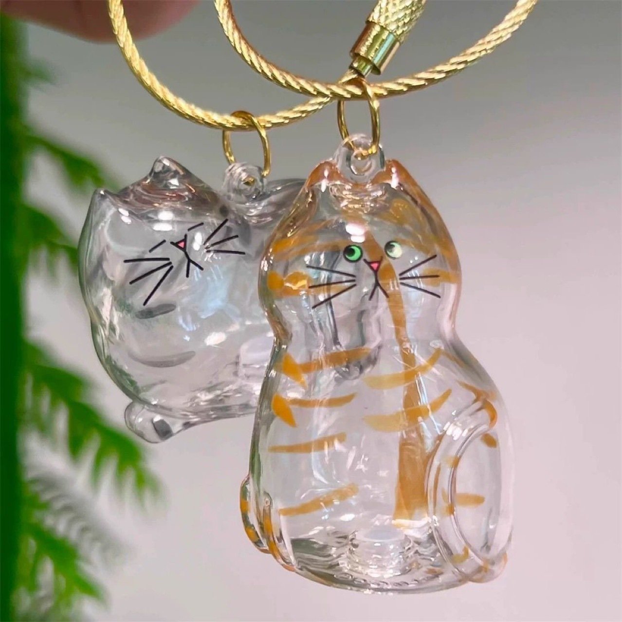💥 Buy 1 Get 1 Free — Transparent Pet Storage Capsule Keychains 🐱